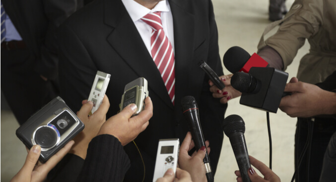 a group of people holding microphones