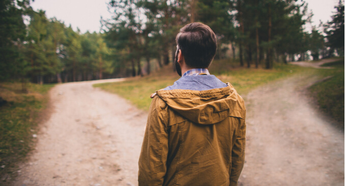 a child walking on a dirt road