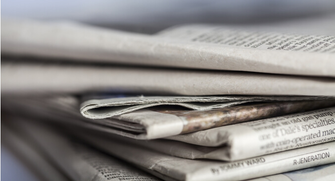 stack of folded newspapers