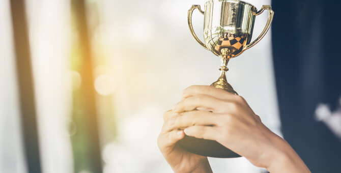 a person holding a trophy