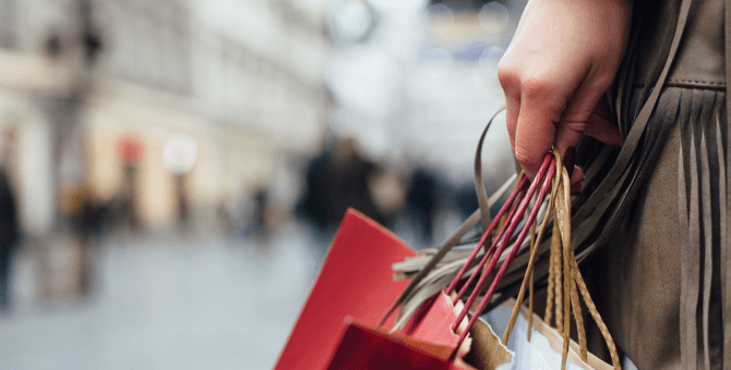 person carrying shopping bags