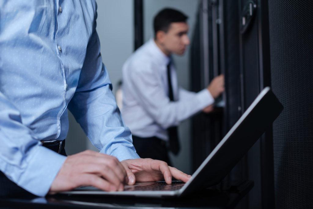 two people working on a computer