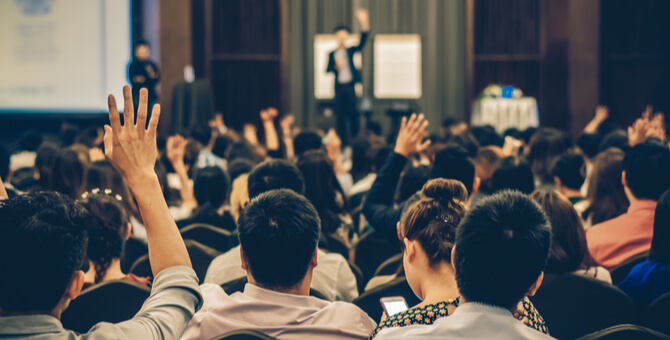 a group of people at a conference