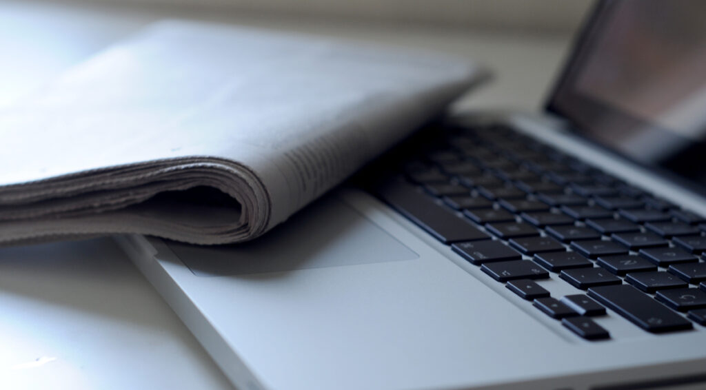 laptop and a newspaper