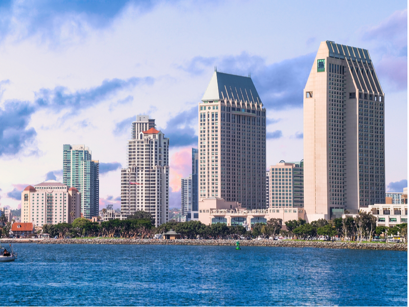 a body of water with buildings in the background