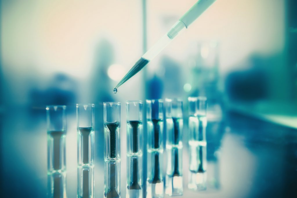 close-up of a syringe and test tubes