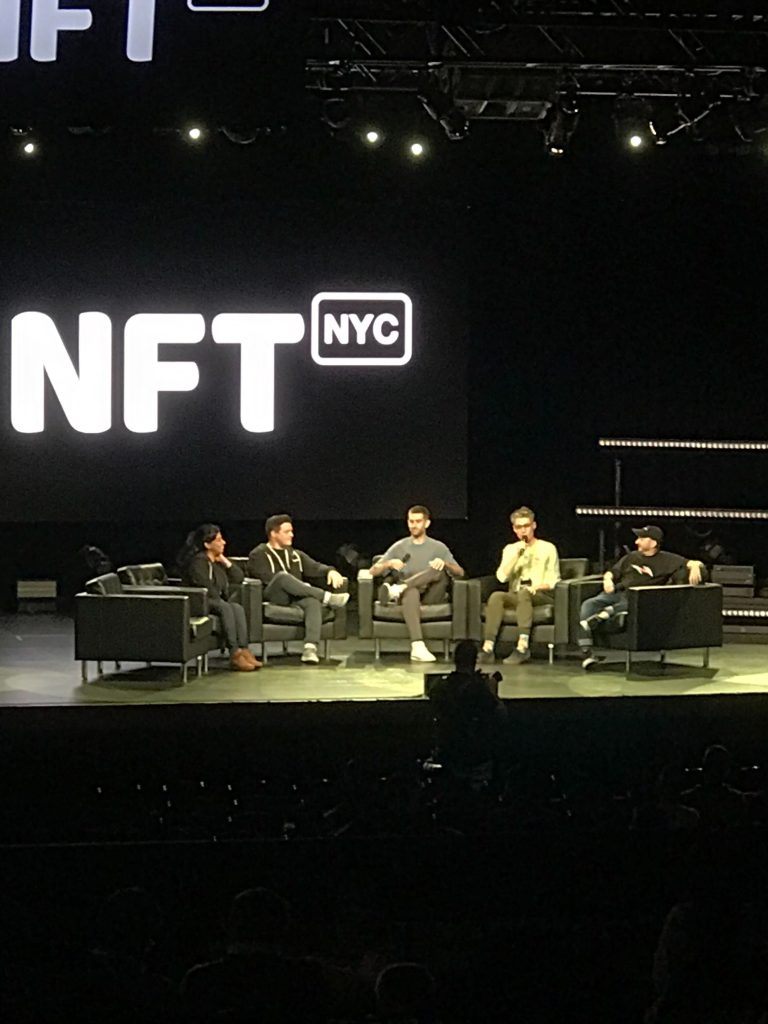 a group of people sitting on a stage